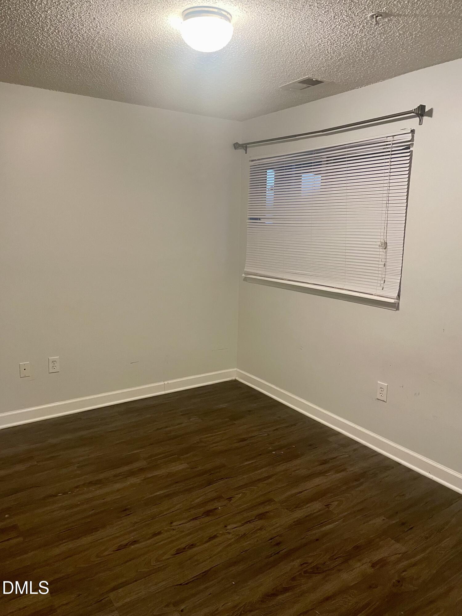 303 Smith Level Road, Unit C12 Chapel Hill, NC 27516 - Photo 15 of 18 a view of a small space with wooden floor and a window