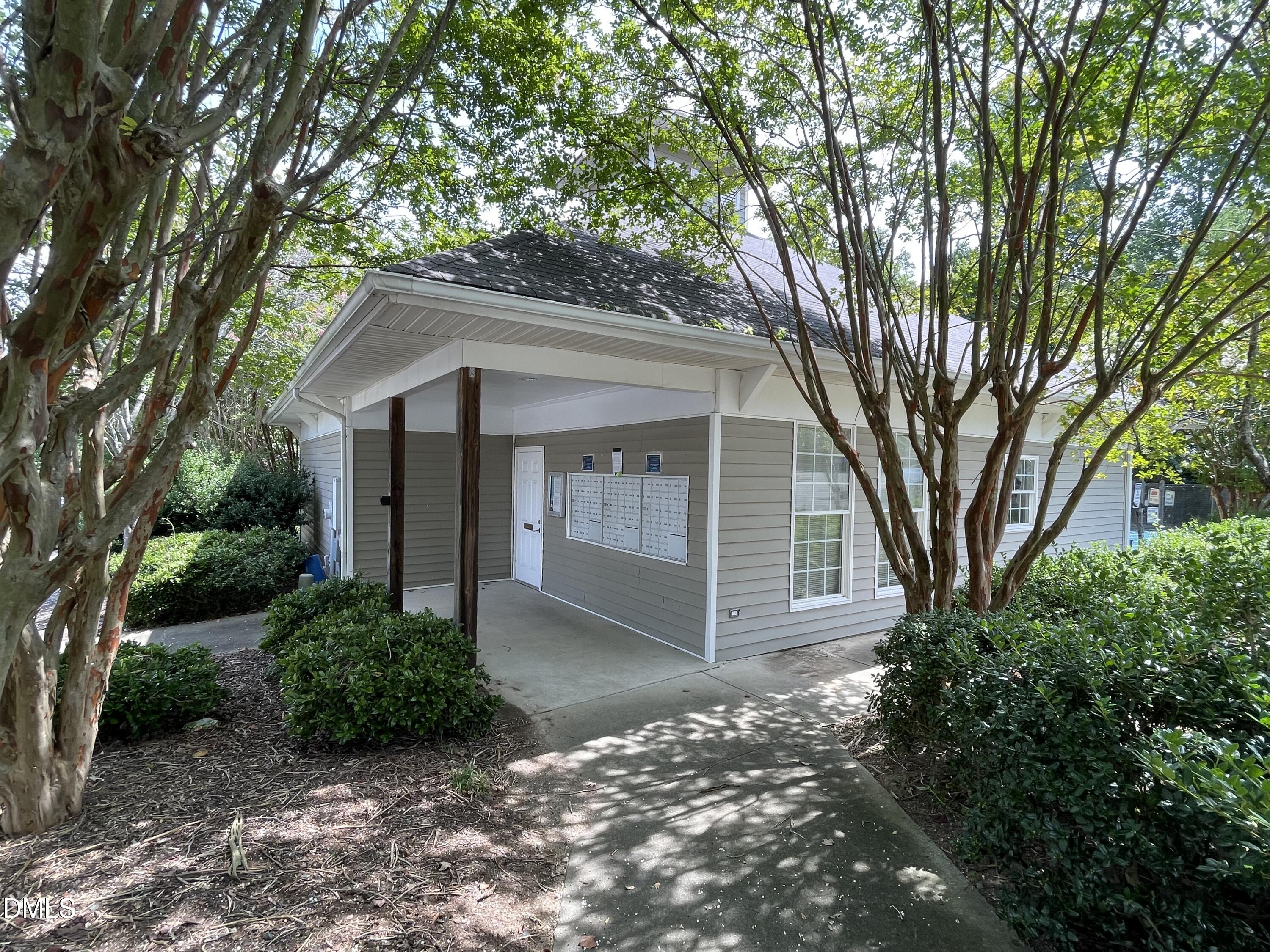 303 Smith Level Road, Unit C12 Chapel Hill, NC 27516 - Photo 16 of 18 a front view of a house with a garden