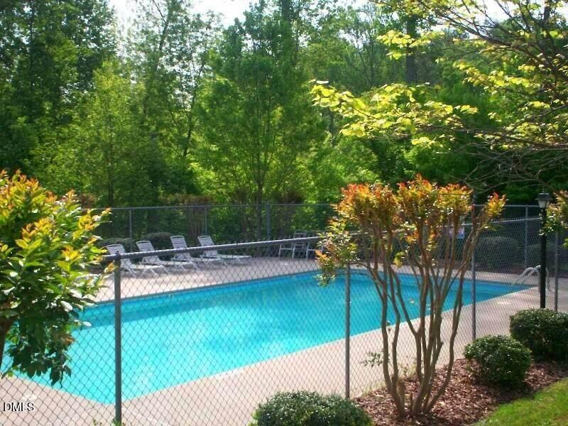 303 Smith Level Road, Unit C12 Chapel Hill, NC 27516 - Photo 18 of 18 a view of a swimming pool with a patio