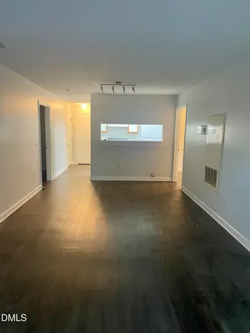 a view of a livingroom with wooden floor