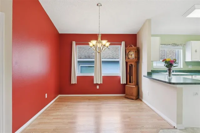 a view of a kitchen with a sink and microwave