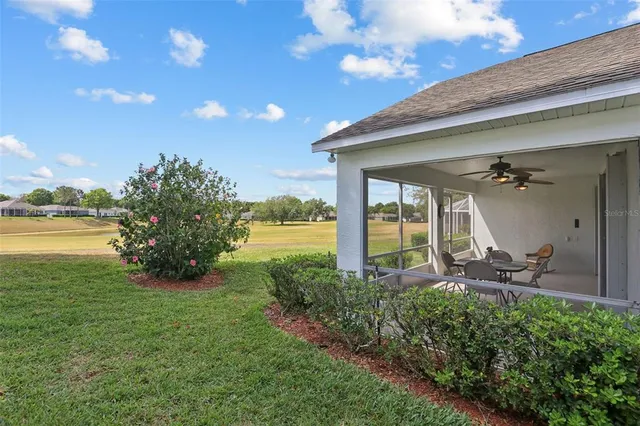 a house view with swimming pool and garden space