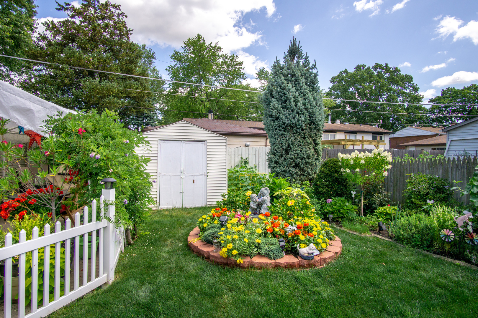385 South Wolf Road Wheeling, IL 60090 - Photo 12 of 14 a garden view with a fountain