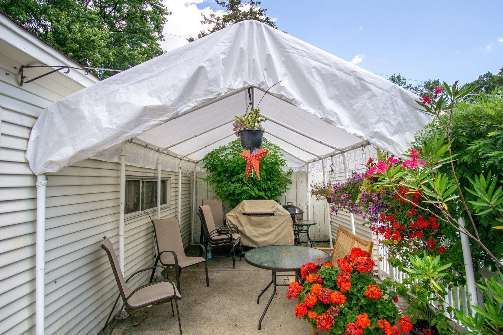 385 South Wolf Road Wheeling, IL 60090 - Photo 14 of 14 a backyard of a house with a garden and entertaining space