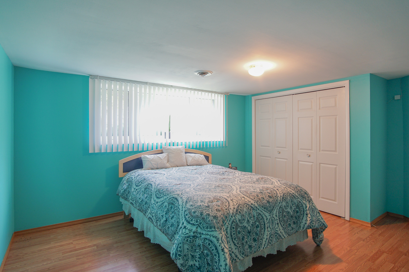 385 South Wolf Road Wheeling, IL 60090 - Photo 8 of 14 a bedroom with a bed and a window