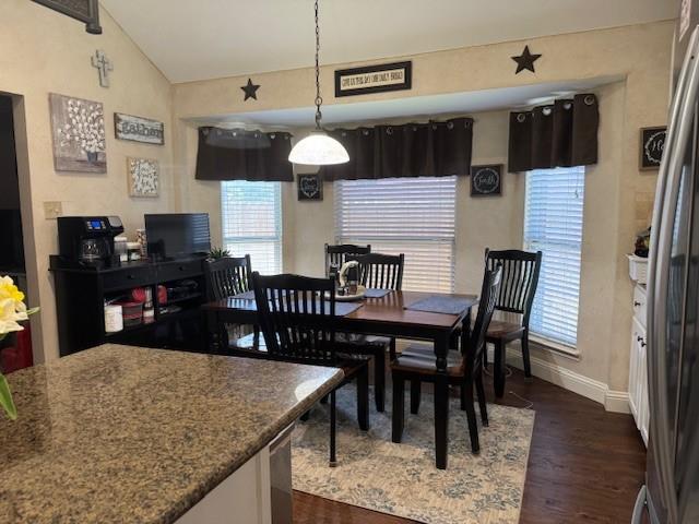 3005 Chaha Road Rowlett, TX 75088 - Photo 8 of 27 a kitchen with a table chairs and a dining table