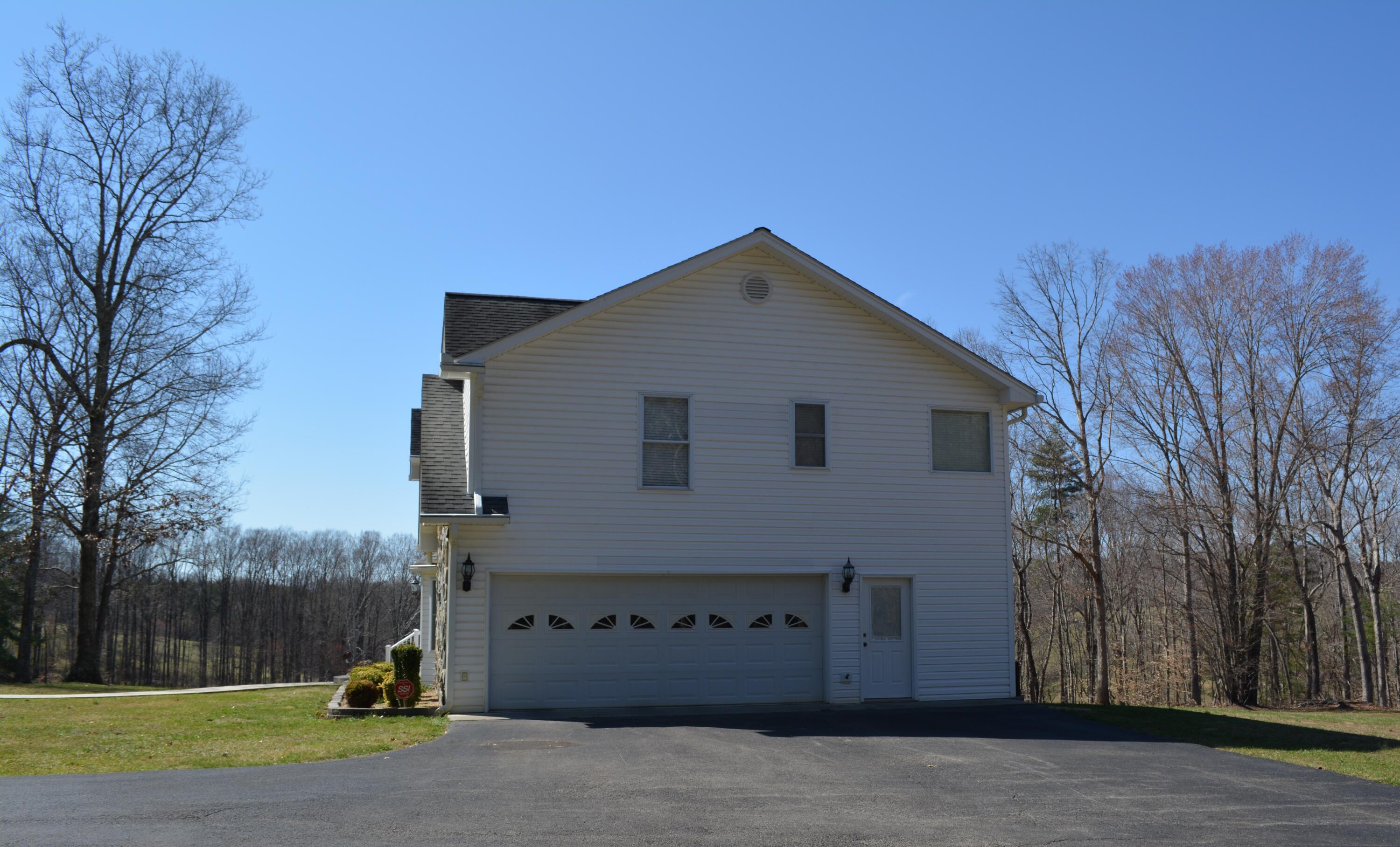 935 Adam Perry Road Rocky Mount, VA 24151 - Photo 5 of 24 a front view of a house with a yard