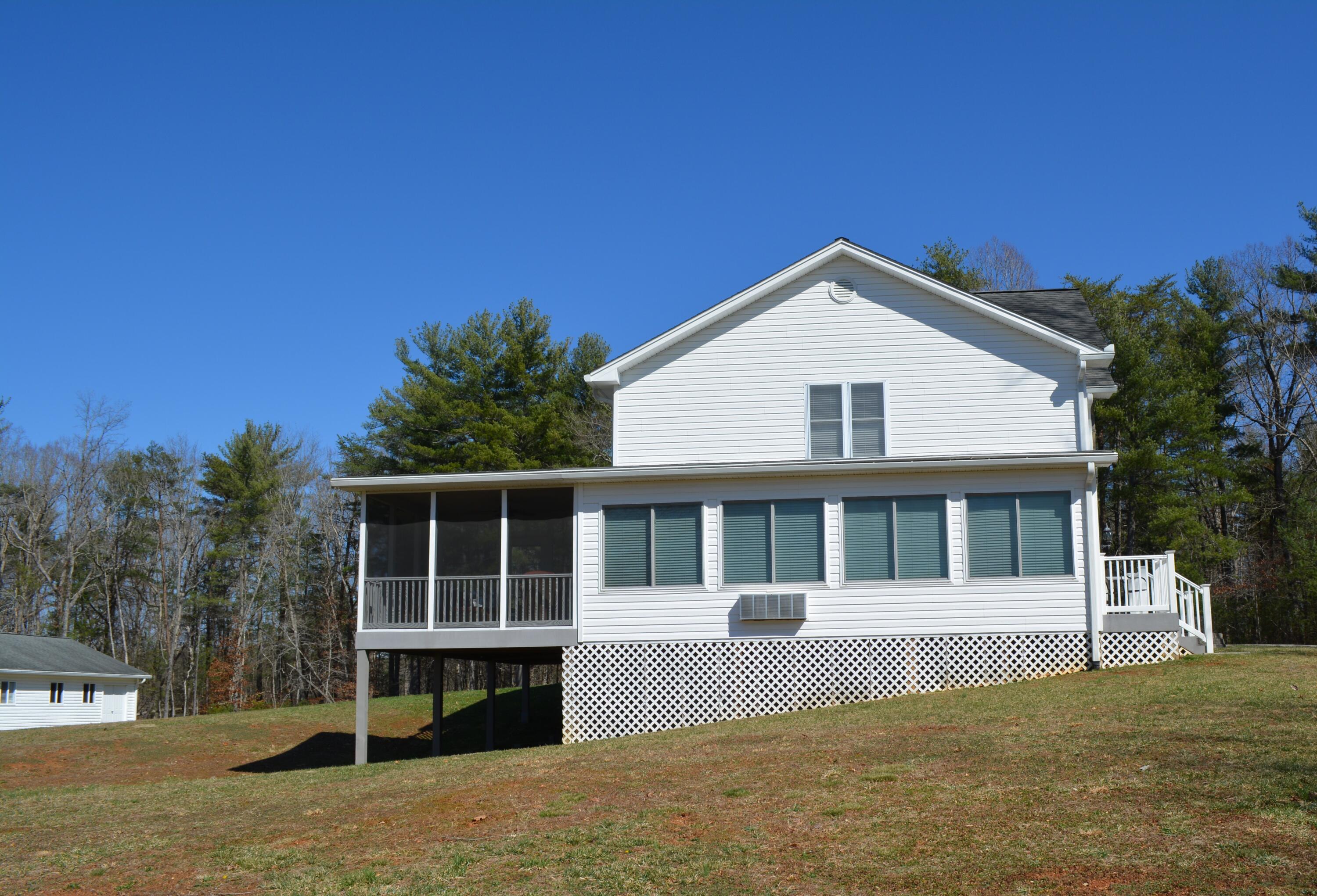 935 Adam Perry Road Rocky Mount, VA 24151 - Photo 9 of 24 a front view of a house with a yard