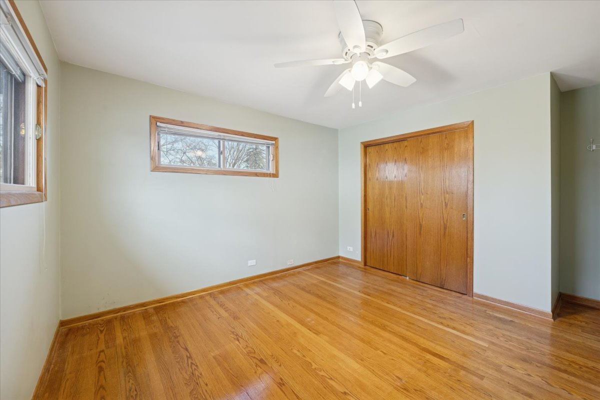 1814 Illinois Road Northbrook, IL 60062 - Photo 13 of 36 a view of an empty room with wooden floor