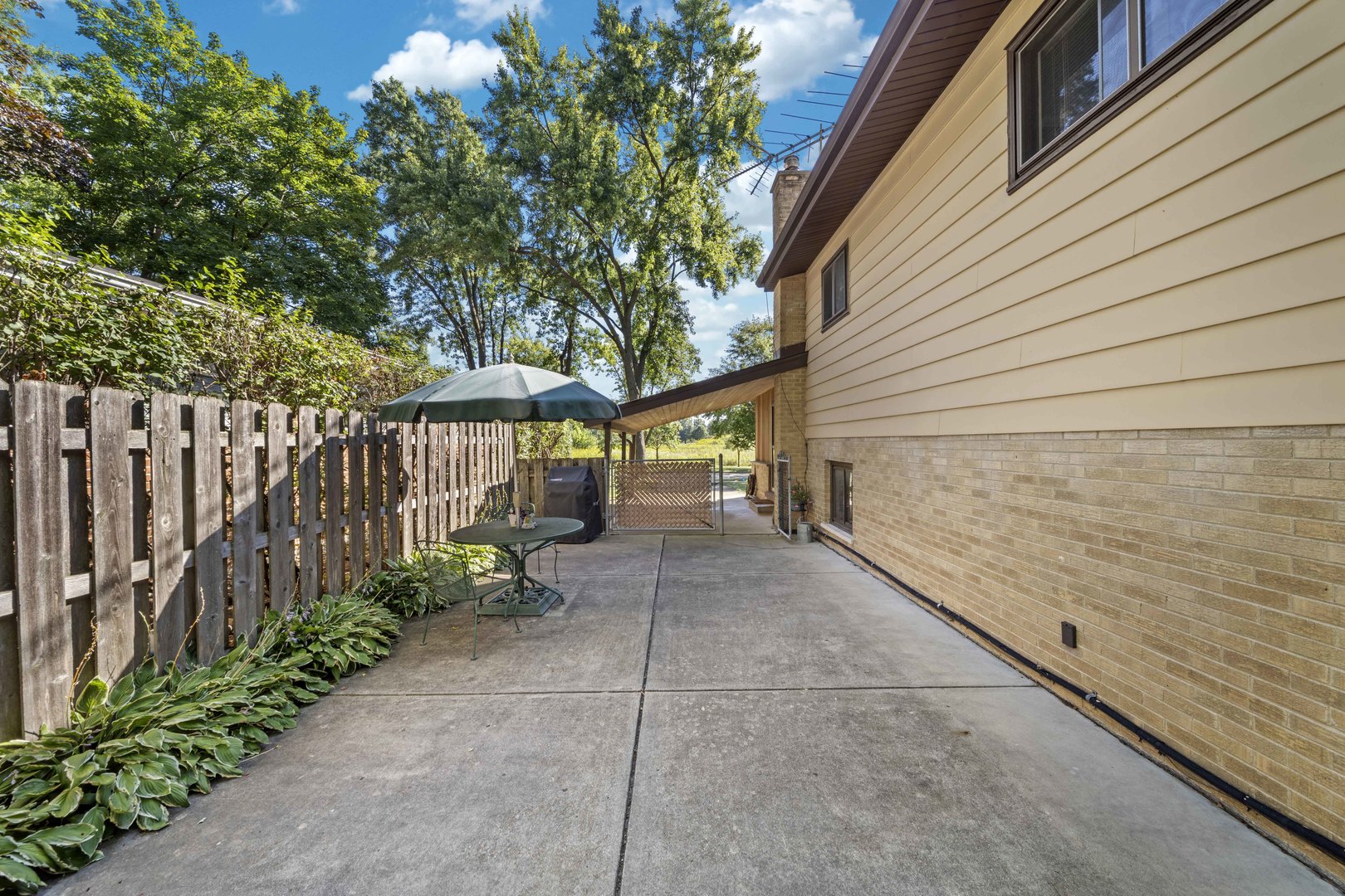 1814 Illinois Road Northbrook, IL 60062 - Photo 25 of 36 a view of a pathway with a wrought fence