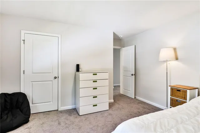 a bedroom with a bed and a walk in closet