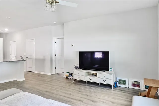 a living room with furniture and flat screen tv