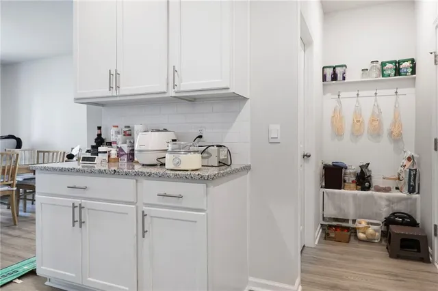 a kitchen with stainless steel appliances granite countertop a sink and cabinets