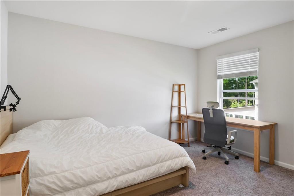 301 Merganser Drive Pooler, GA 31322 - Photo 10 of 18 a bedroom with a bed a desk and chair