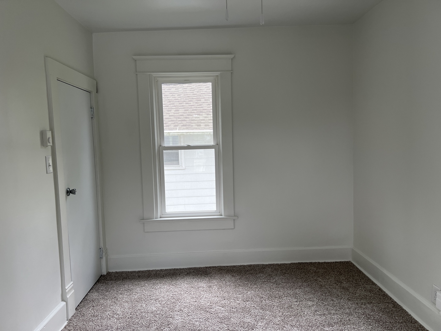 107 West Weldon Street Roberts, IL 60962 - Photo 13 of 21 an empty room with a window