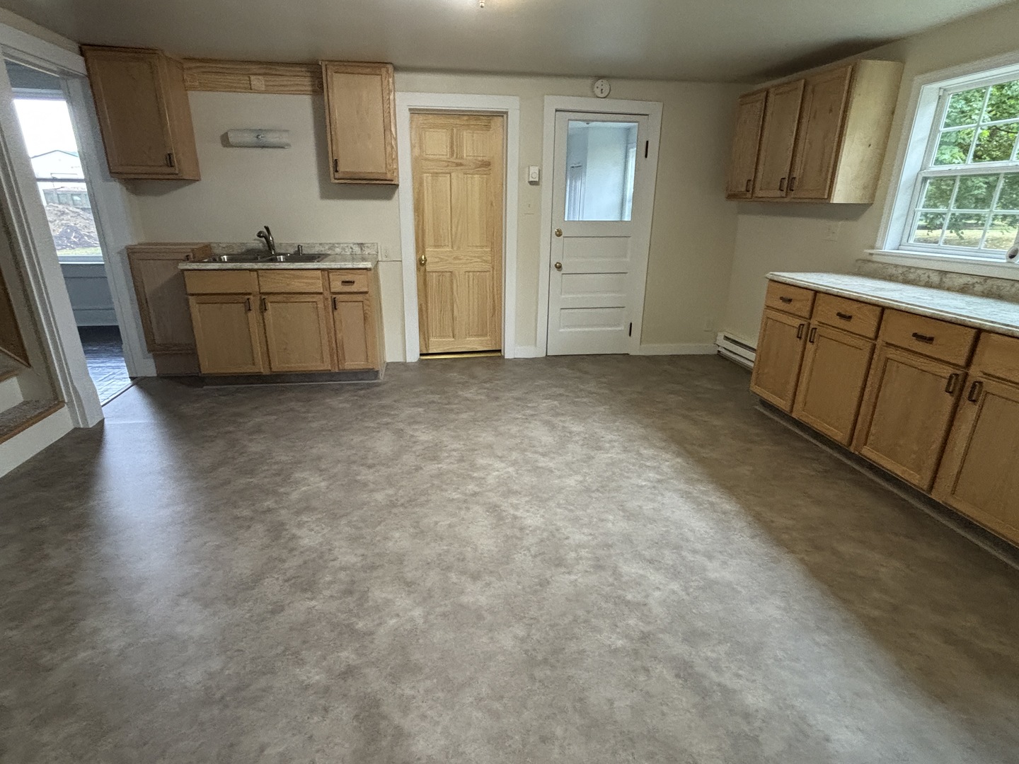 107 West Weldon Street Roberts, IL 60962 - Photo 8 of 21 a kitchen with granite countertop a refrigerator stove top oven and sink