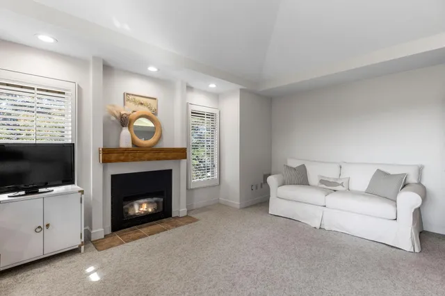 a bedroom with a bed and a fireplace