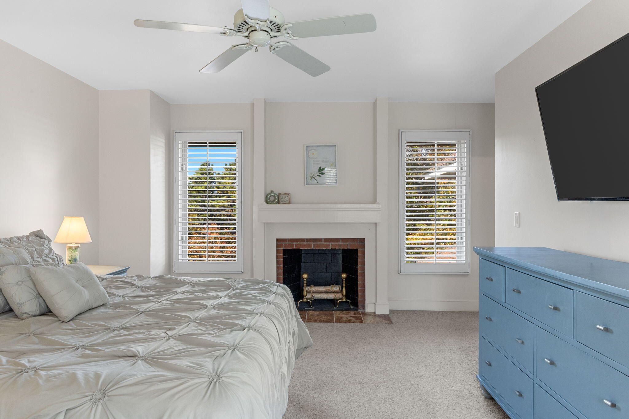 2 Dogwood Road, Unit 2 Buzzards Bay, MA 02532 - Photo 33 of 49 a bedroom with a bed and a fireplace