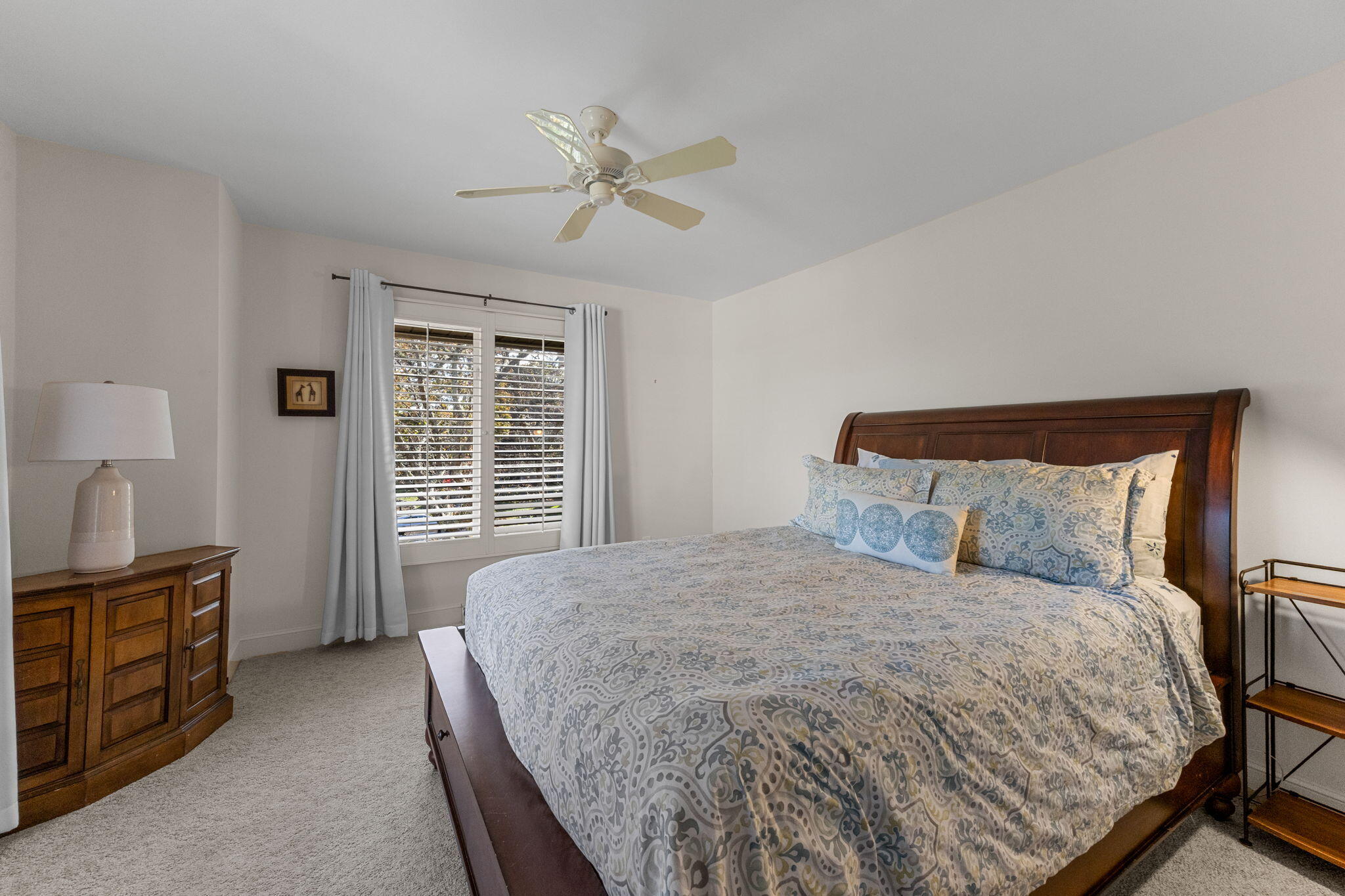 2 Dogwood Road, Unit 2 Buzzards Bay, MA 02532 - Photo 36 of 49 a bedroom with a bed and a chandelier