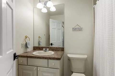 a view of a balcony with chairs