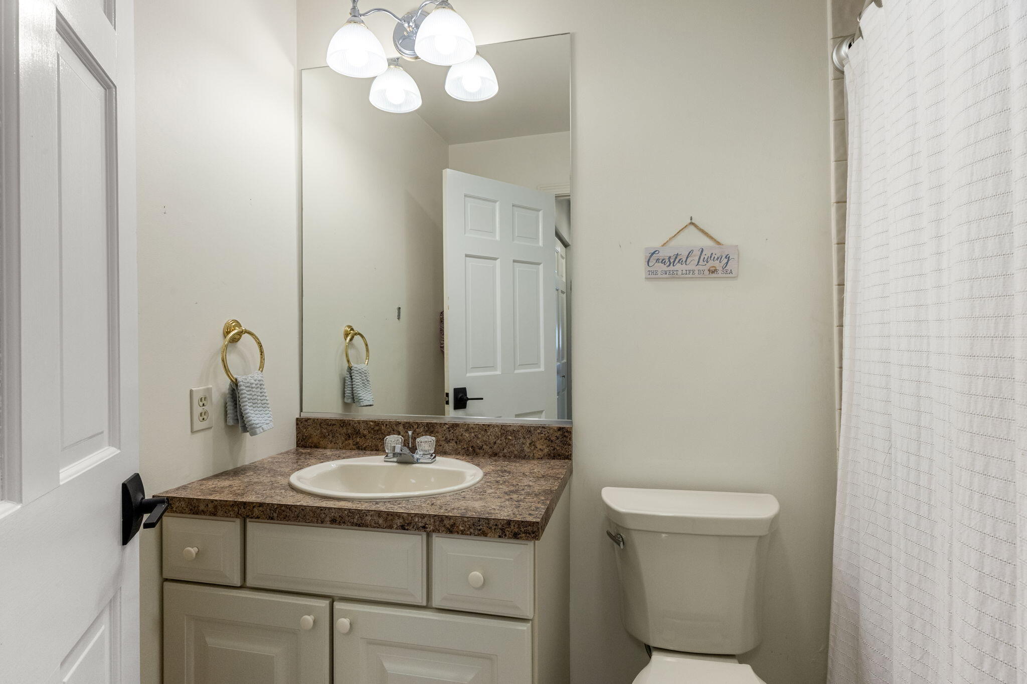 2 Dogwood Road, Unit 2 Buzzards Bay, MA 02532 - Photo 38 of 49 a bathroom with a granite countertop sink a toilet and a mirror