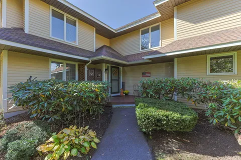 a view of a pathway with a house