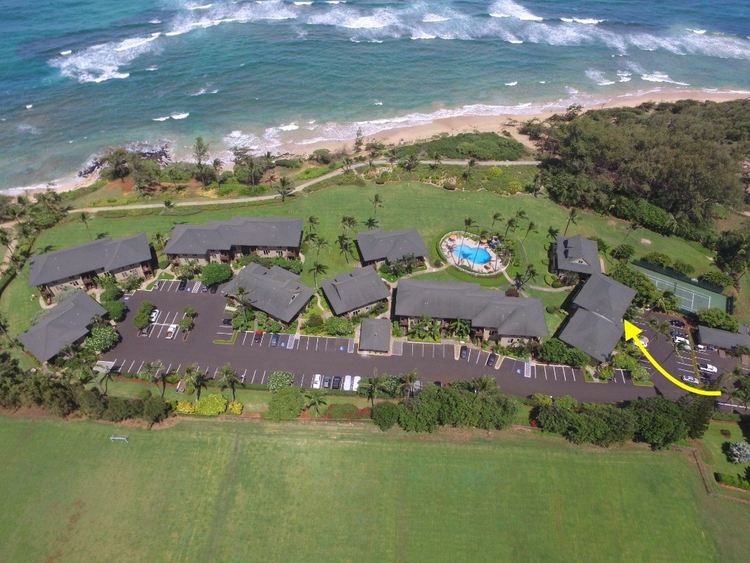 4460 Nehe Road, Unit 104 Lihue, HI 96766 - Photo 3 of 4 an aerial view of residential houses with outdoor space and lake view