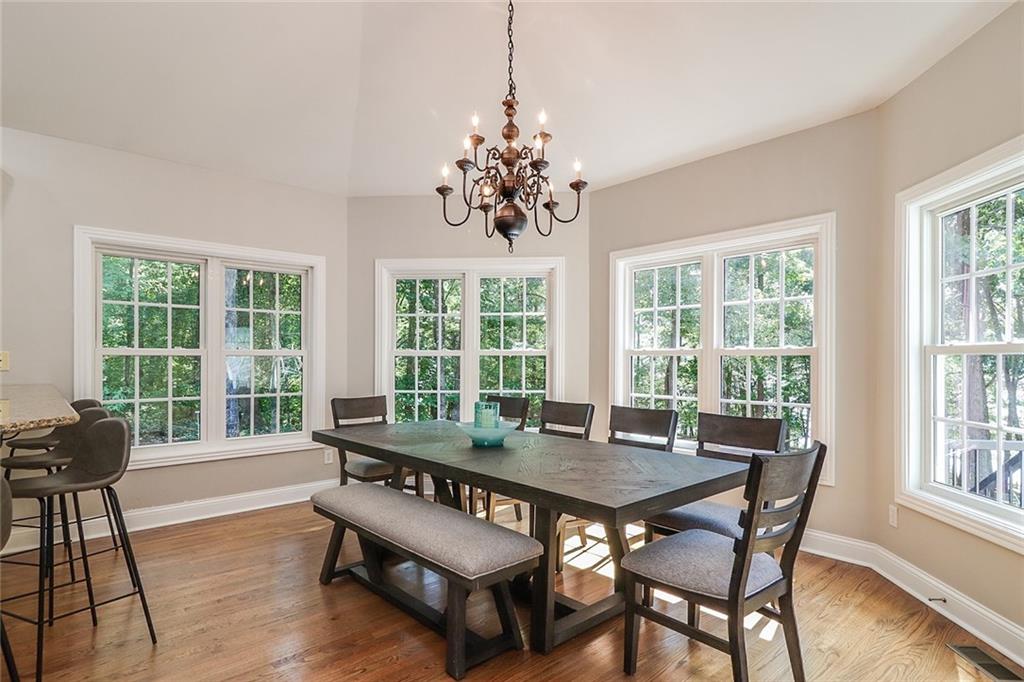 6150 Six Mile Cove Road Cumming, GA 30041 - Photo 5 of 27 a view of a dining room with furniture window and outside view