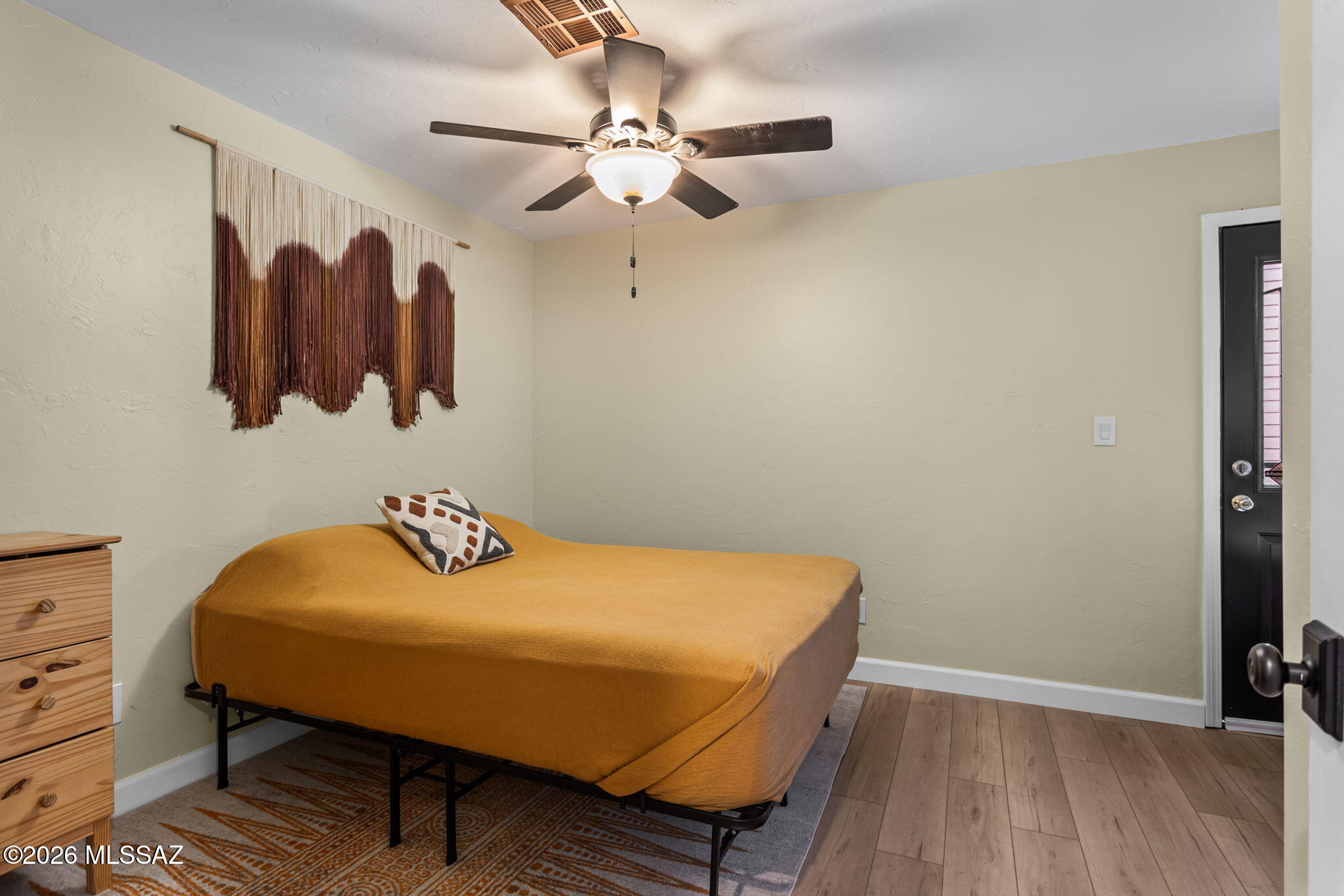 4210 West Mossman Road Tucson, AZ 85746 - Photo 32 of 51 a bedroom with a bed and furniture