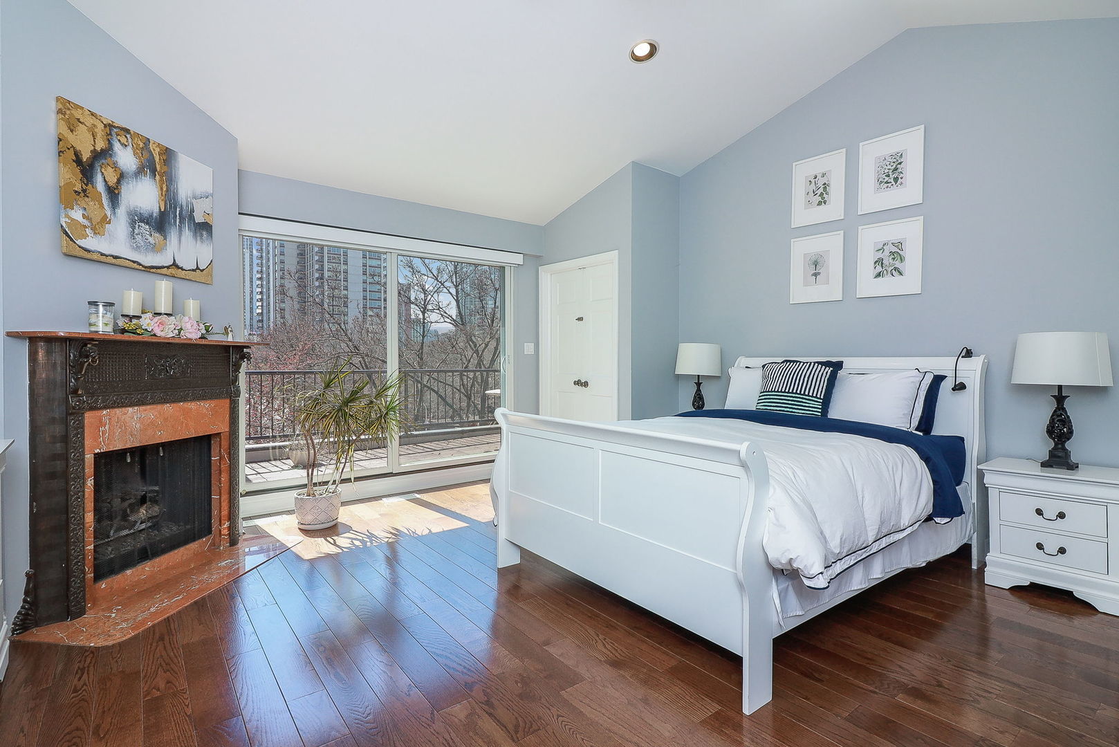 1346 North Sutton Place Chicago, IL 60610 - Photo 11 of 25 a bedroom with a bed and a fireplace