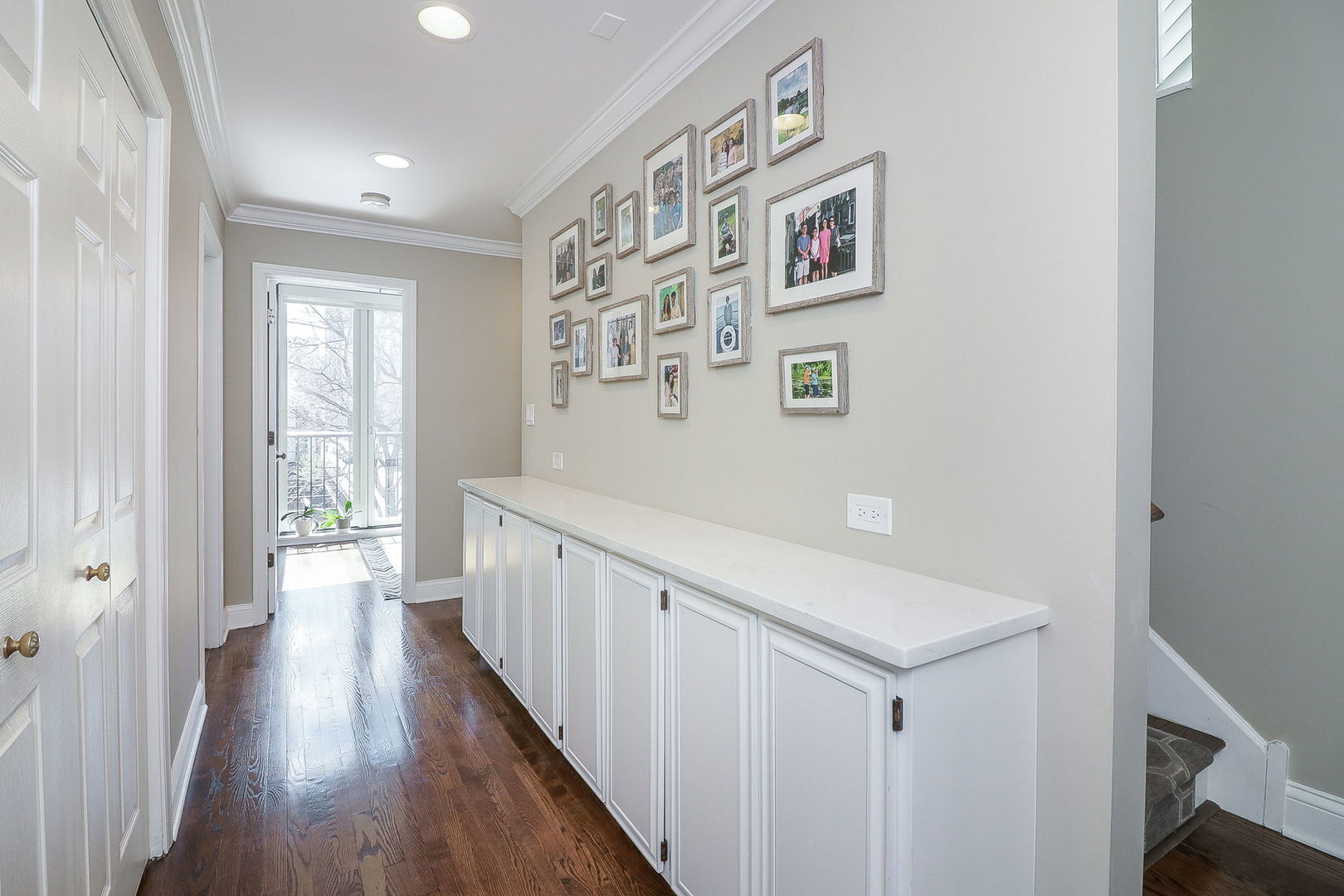 1346 North Sutton Place Chicago, IL 60610 - Photo 18 of 25 a view of a hallway with wooden floor and windows