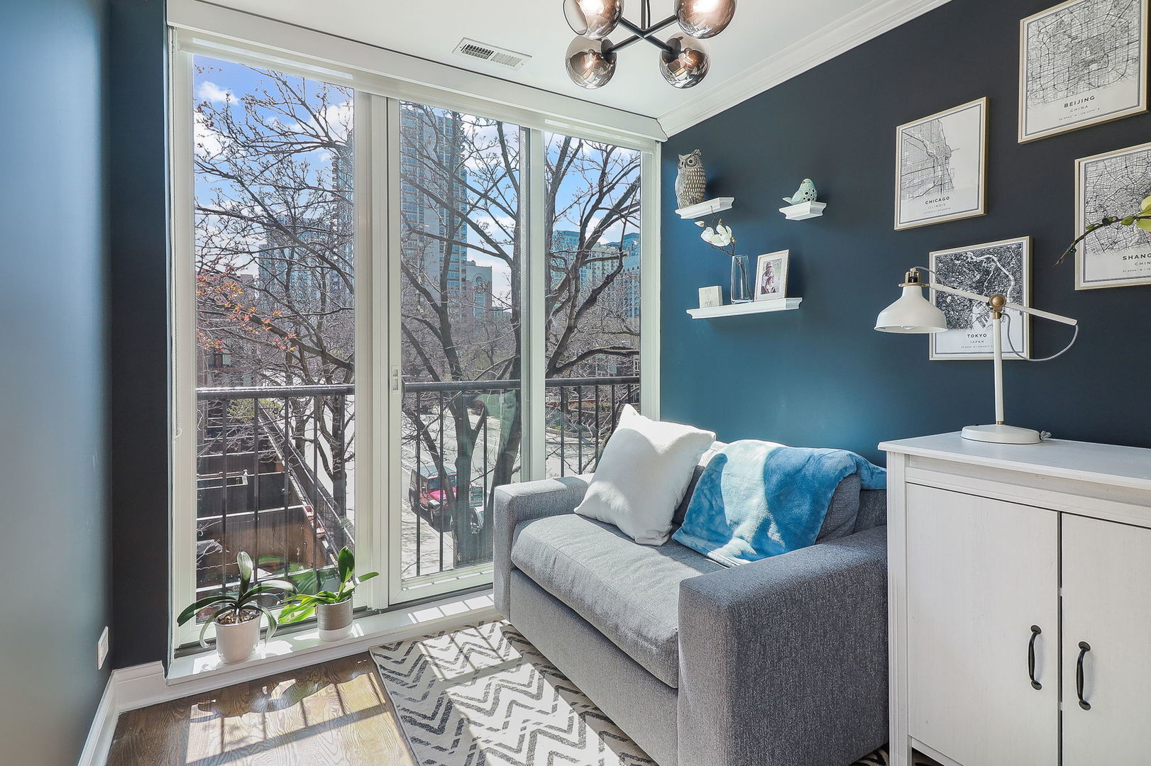 1346 North Sutton Place Chicago, IL 60610 - Photo 20 of 25 a living room with furniture and a floor to ceiling window
