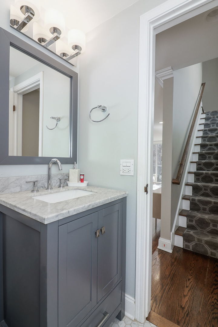 1346 North Sutton Place Chicago, IL 60610 - Photo 21 of 25 a en suite bathroom with a granite countertop sink and a mirror