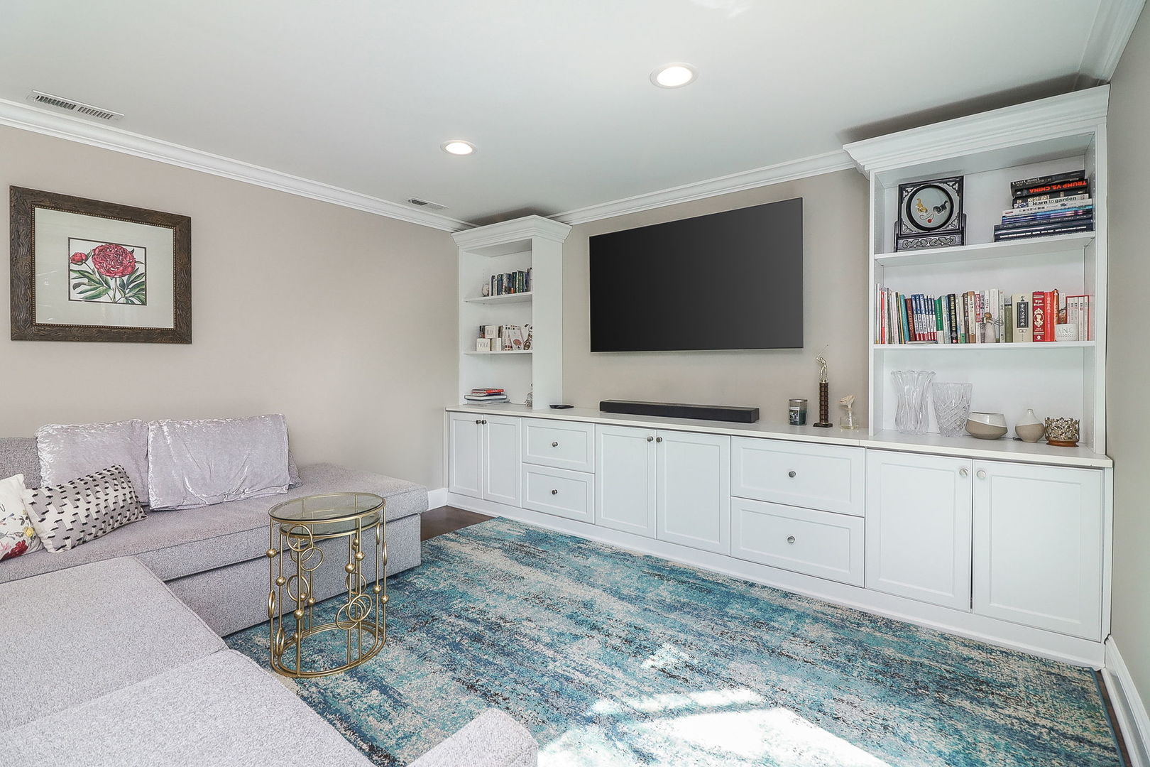 1346 North Sutton Place Chicago, IL 60610 - Photo 22 of 25 a living room with furniture and a flat screen tv