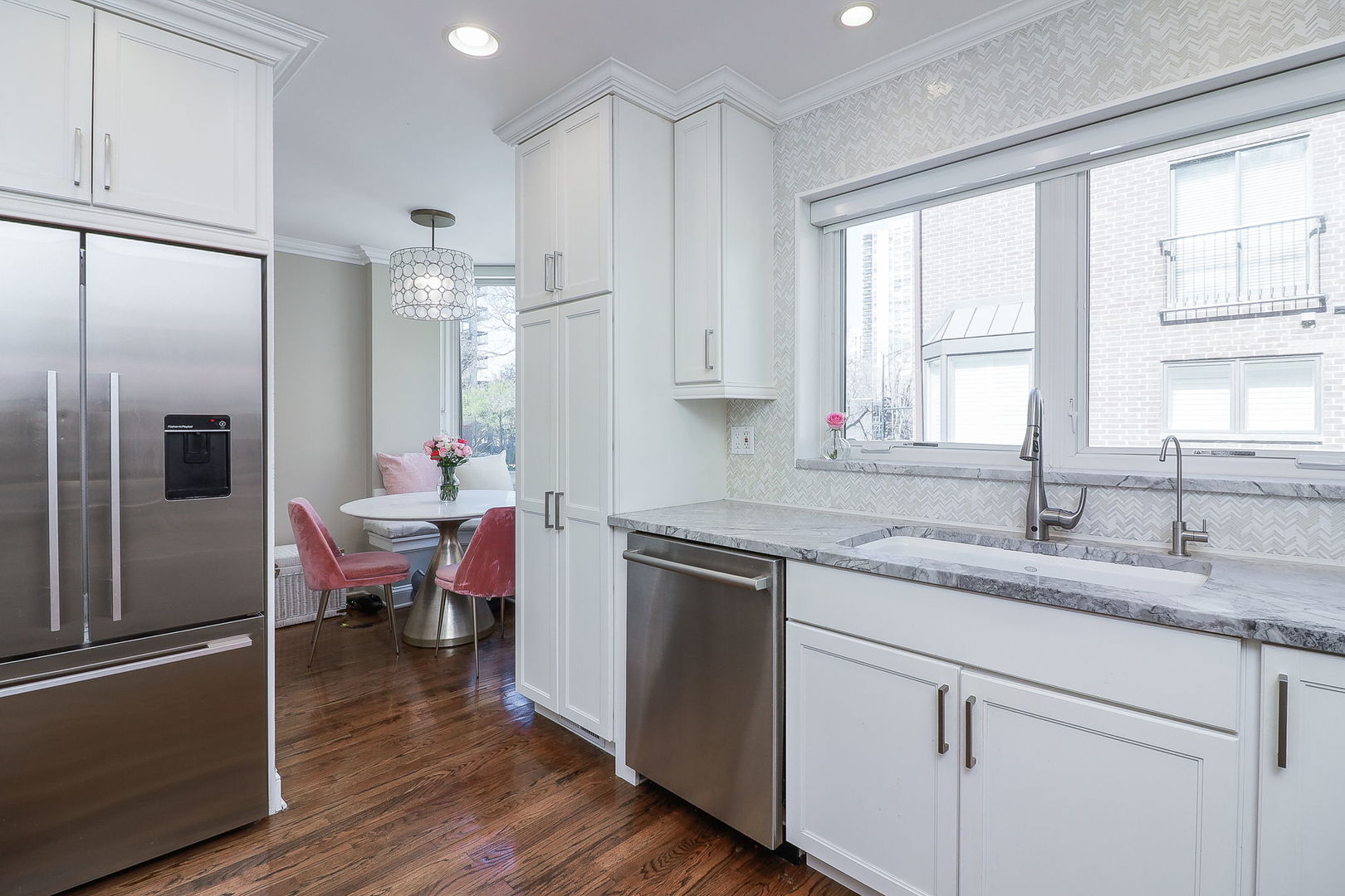 1346 North Sutton Place Chicago, IL 60610 - Photo 9 of 25 a kitchen with a refrigerator sink and cabinets
