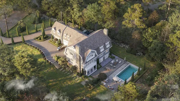 an aerial view of a house with a yard