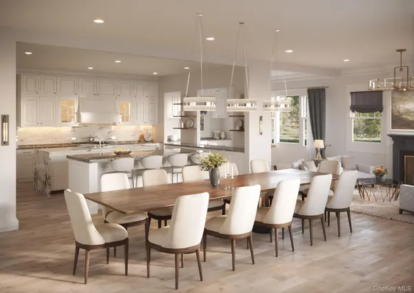 a dining room with stainless steel appliances kitchen island granite countertop a dining table chairs and view kitchen