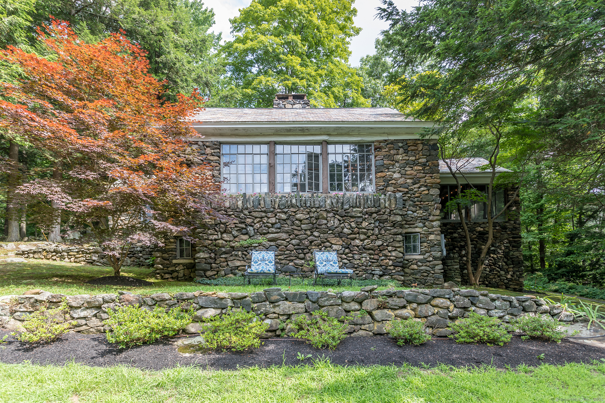 60 Leach Hollow Road Sherman, CT 06784 - Photo 1 of 24 a front view of a house with a garden