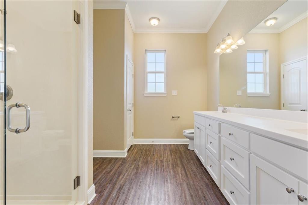 14356 China Spring Road China Spring, TX 76633 - Photo 16 of 36 a spacious bathroom with a double vanity sink a mirror and a shower