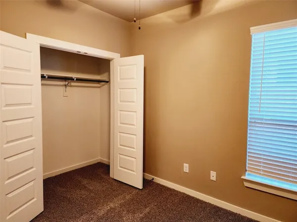 an empty room with closet