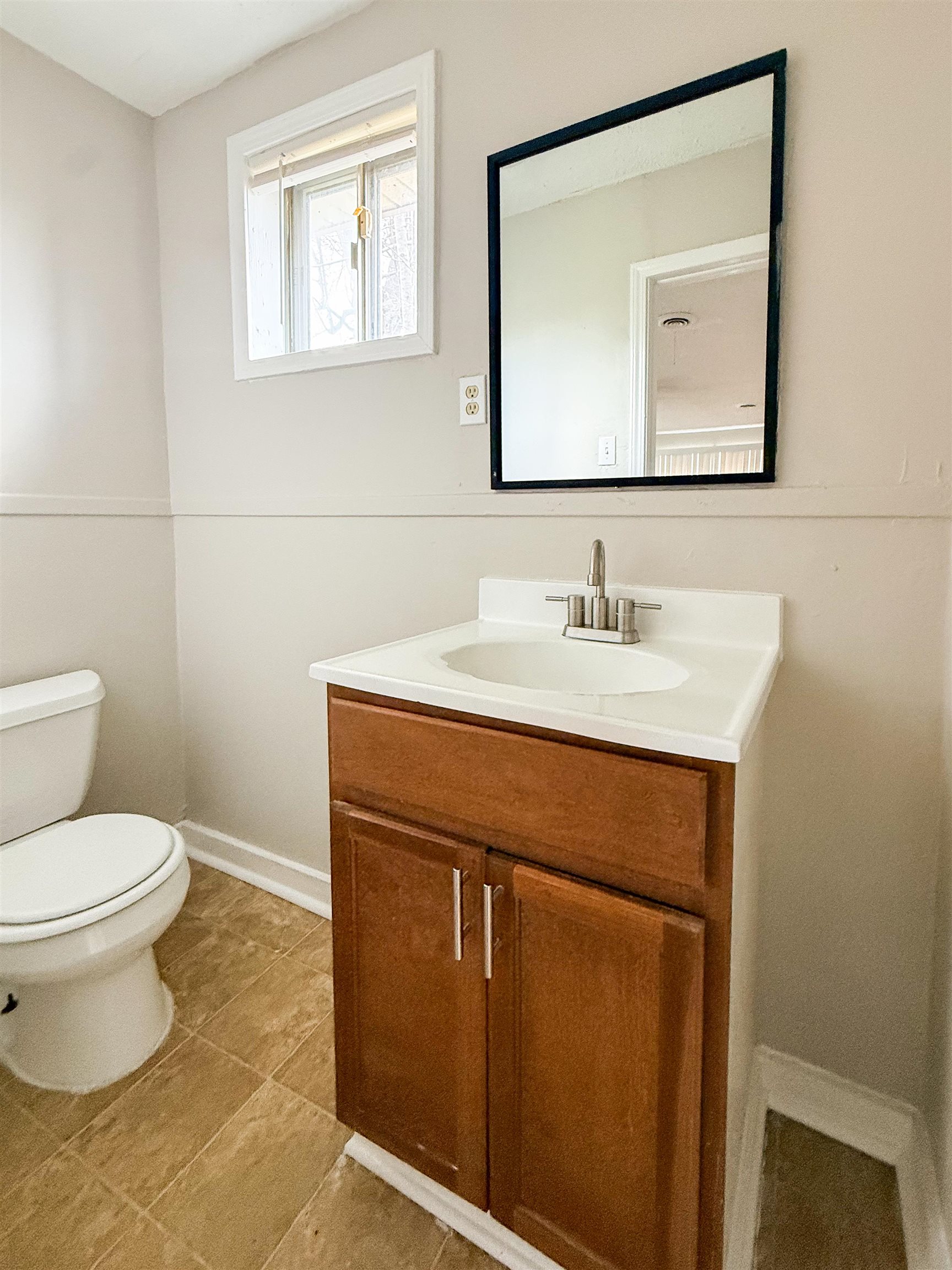 655 West Raines Road Memphis, TN 38109 - Photo 13 of 18 Bathroom featuring vanity and light tile patterned floors