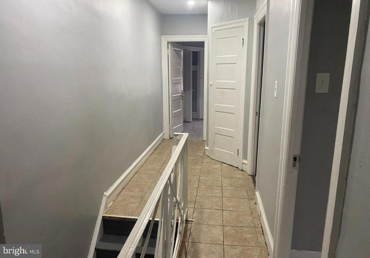 6550 Regent Street Philadelphia, PA 19142 - Photo 12 of 12 a view of an empty room with wooden floor