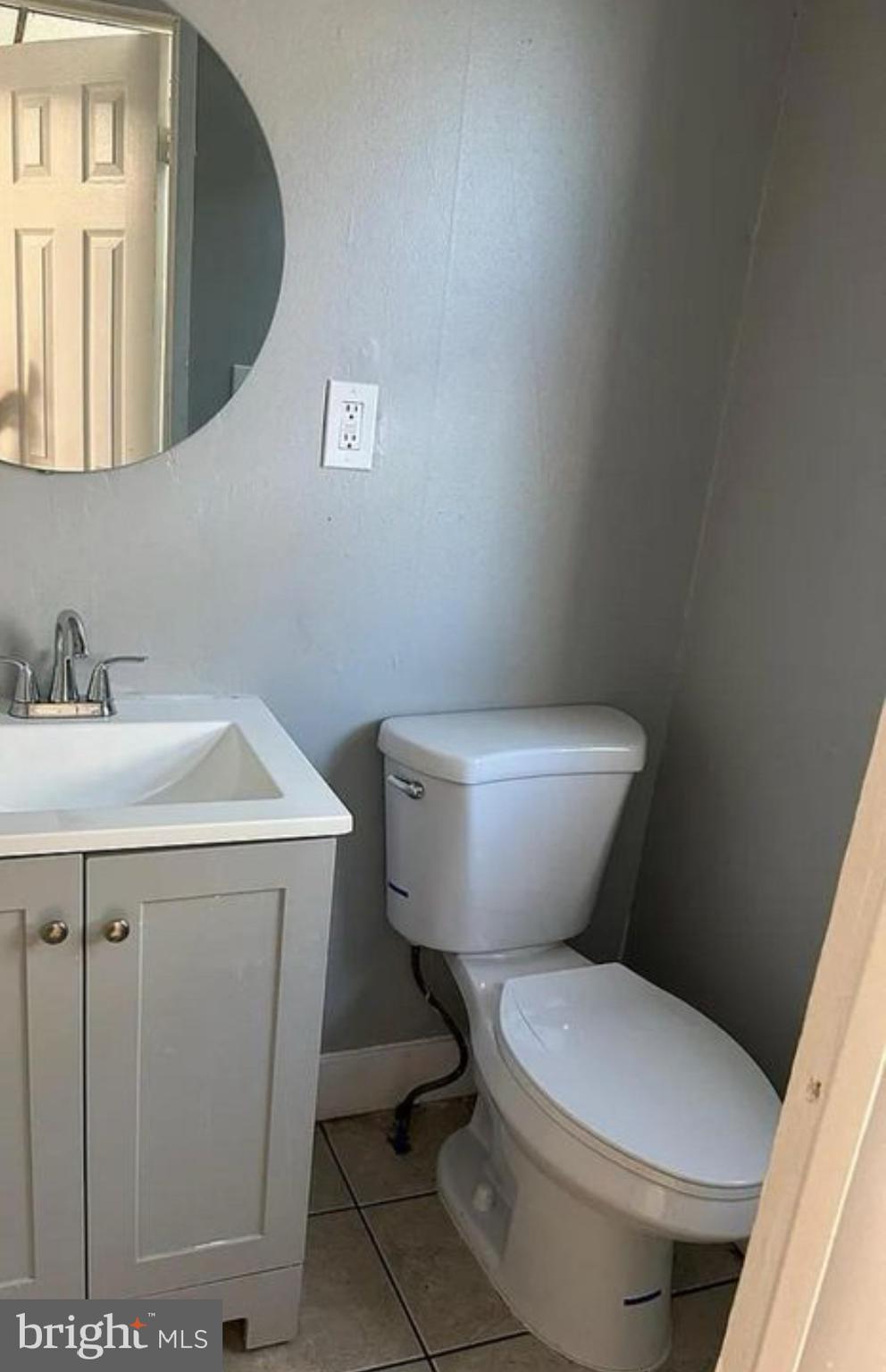 6550 Regent Street Philadelphia, PA 19142 - Photo 3 of 12 a white toilet sitting next to a bathroom sink