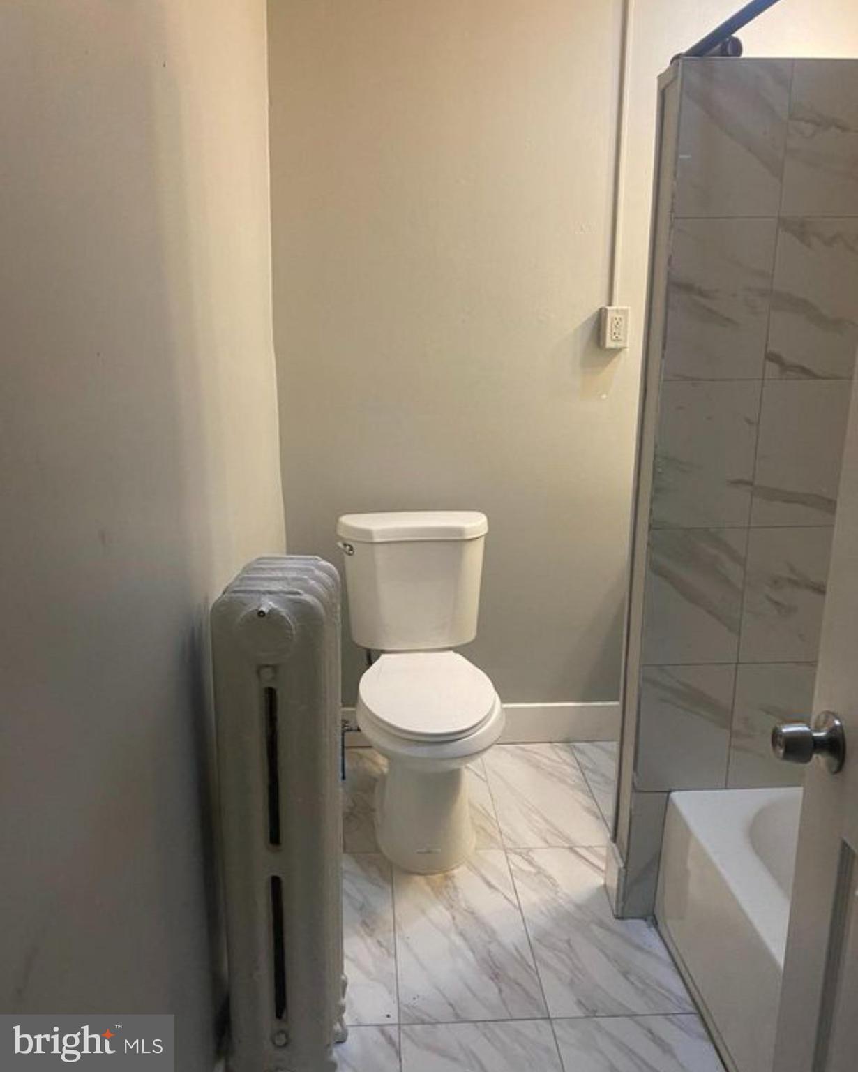 6550 Regent Street Philadelphia, PA 19142 - Photo 10 of 12 a bathroom with a toilet and a shower