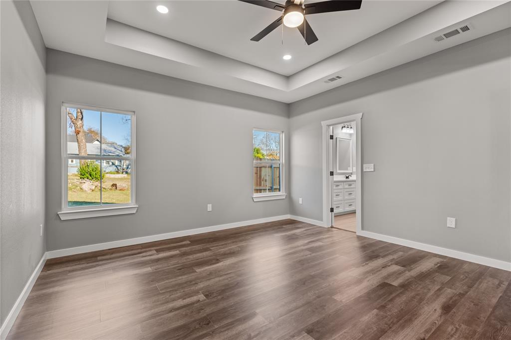 2020 Bosque Boulevard Waco, TX 76707 - Photo 11 of 27 wooden floor in an empty room with a window