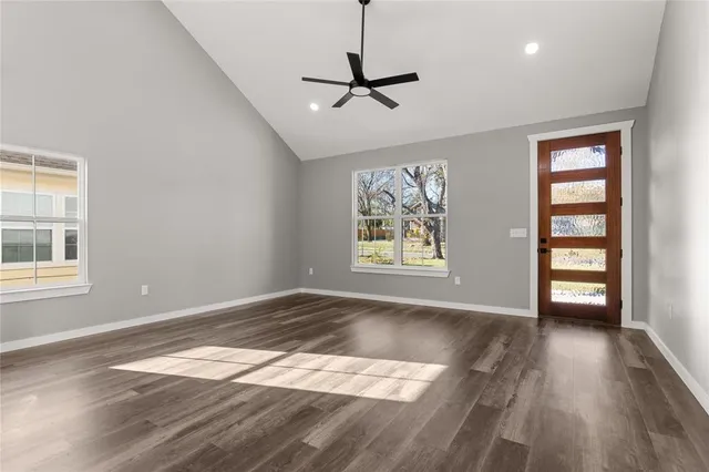 wooden floor in an empty room with a window