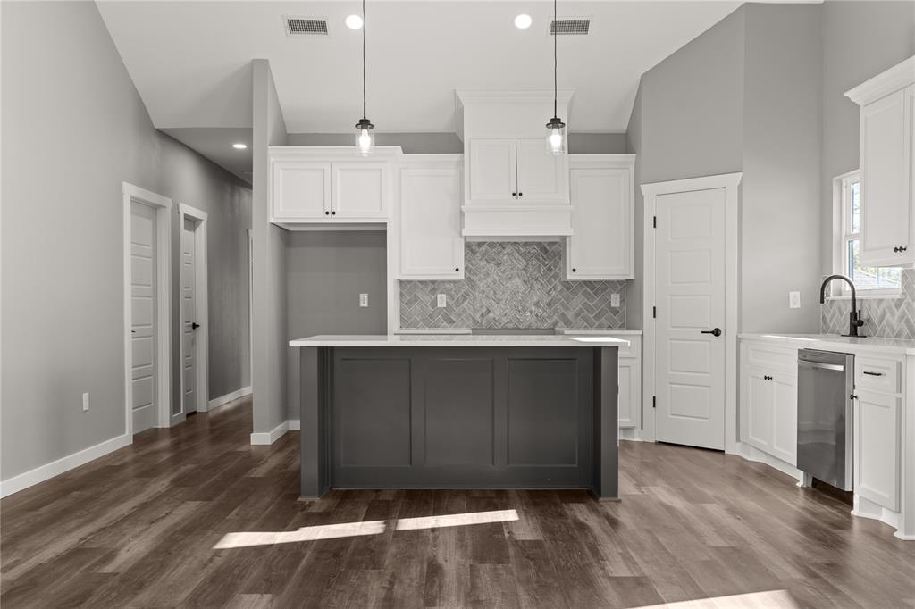 2020 Bosque Boulevard Waco, TX 76707 - Photo 7 of 27 a kitchen with kitchen island cabinets and wooden floor