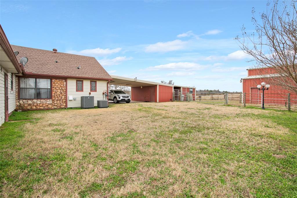 649 Highway 84 Fairfield, TX 75840 - Photo 26 of 39 a view of a house with a yard