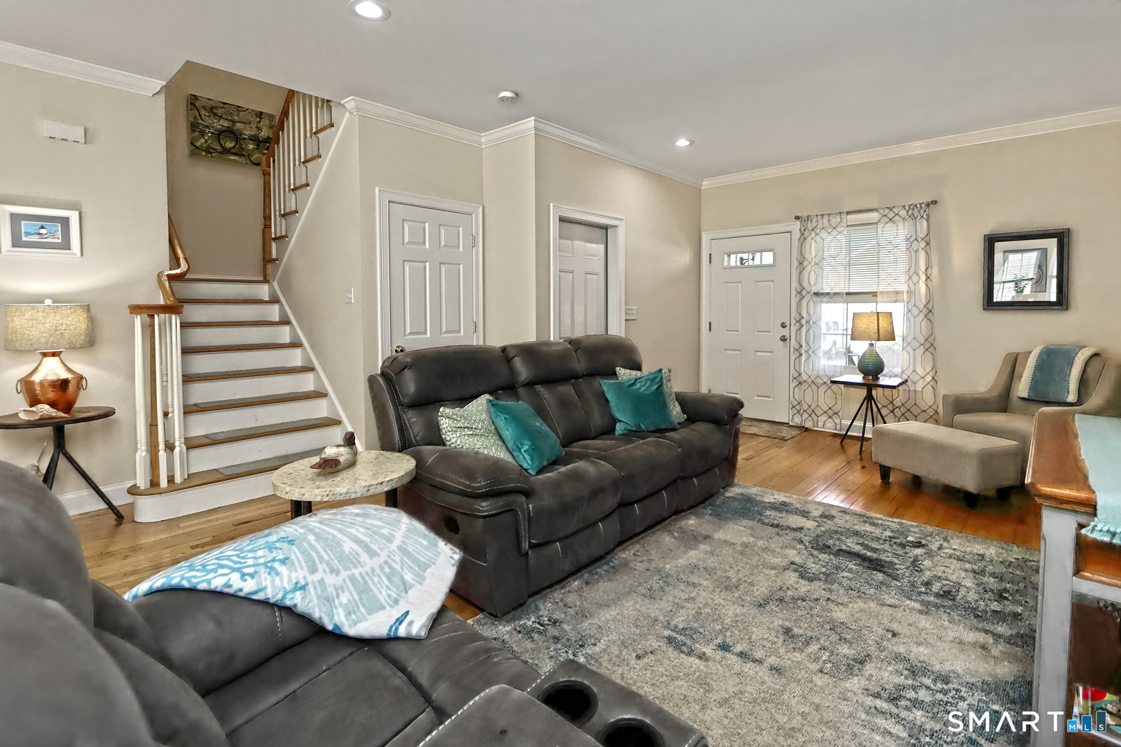 102 Lantern Court, Unit 102 Clinton, CT 06413 - Photo 11 of 36 a living room with furniture and a couch