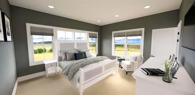 a bed room with a bed and a chair